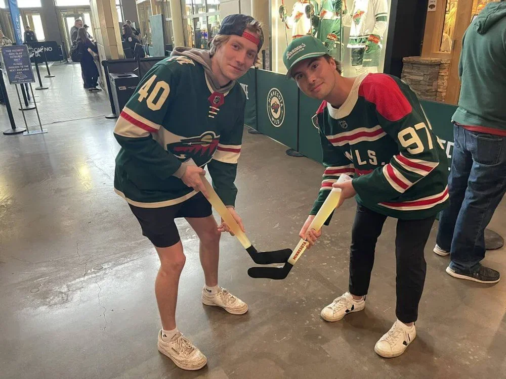 Wild fans are pictured posing with the Beer Twigs before Monday's game.