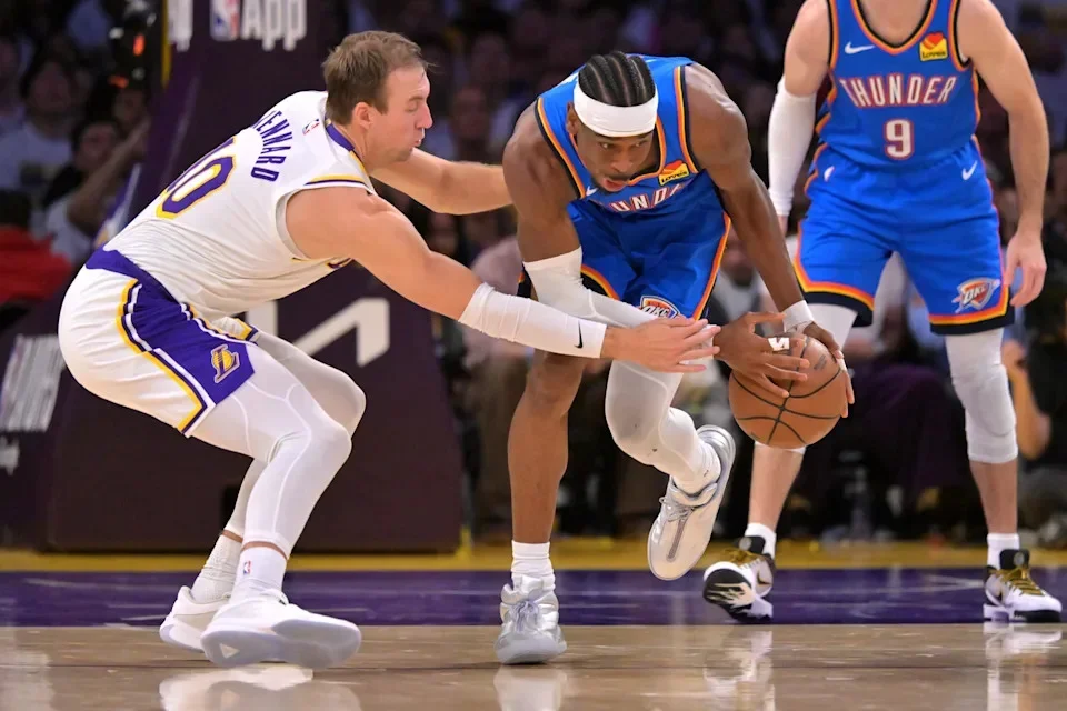 May 9, 2026; Los Angeles, California, USA; Los Angeles Lakers guard Luke Kennard (10) defends Oklahoma City Thunder guard Shai Gilgeous-Alexander (2) as he grabs a loose ball the second half of game three of the second round of the 2026 NBA Playoffs at Crypto.com Arena. Mandatory Credit: Jayne Kamin-Oncea-Imagn Images