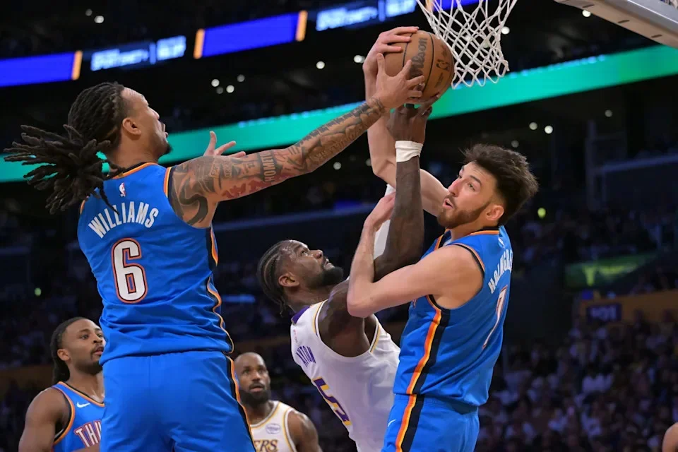 May 9, 2026; Los Angeles, California, USA; Oklahoma City Thunder forward Jaylin Williams (6) and center Chet Holmgren (7) defend a shot by Los Angeles Lakers center Deandre Ayton (5) during the first quarter of game three of the second round of the 2026 NBA Playoffs at Crypto.com Arena. Mandatory Credit: Jayne Kamin-Oncea-Imagn Images
